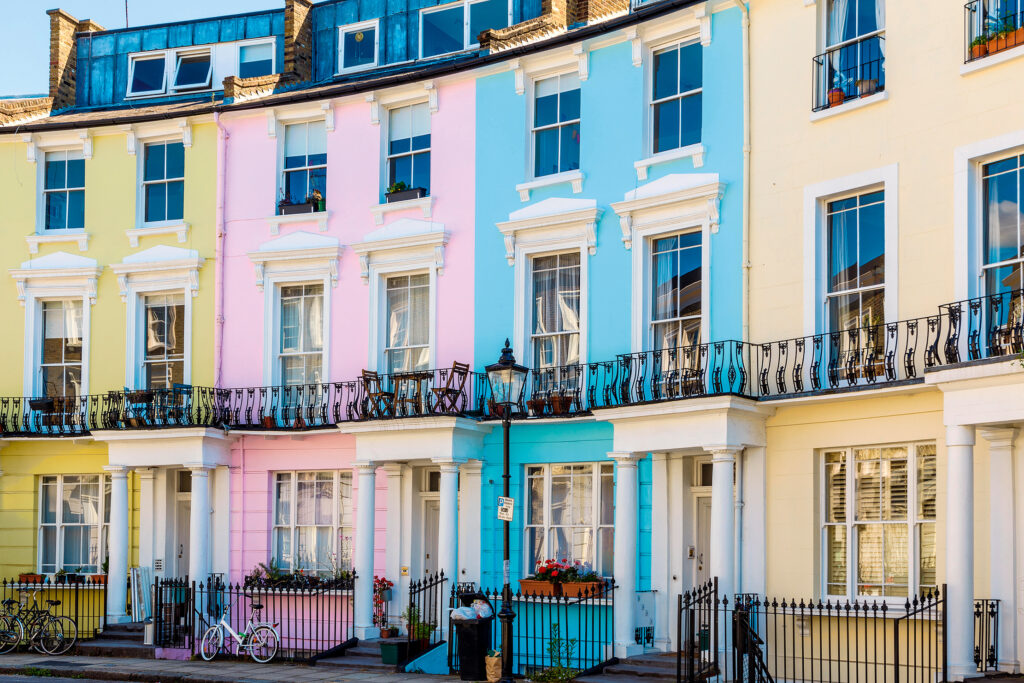 Row of Pastel coloured English terraced houses in Primrose Hill, London, UK