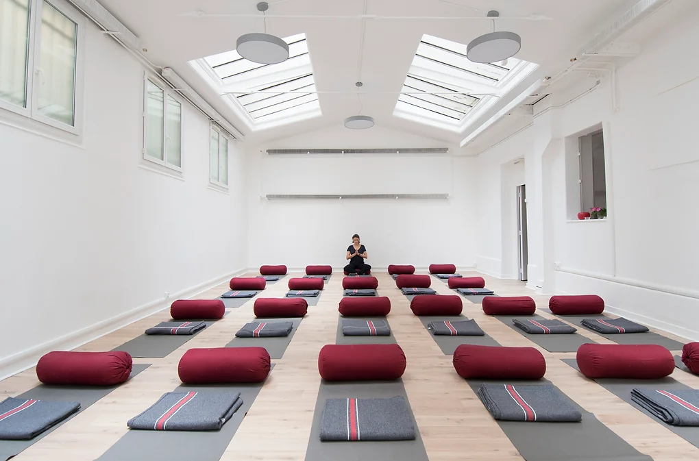 Naturally lit Yoga studio with big ceiling windows